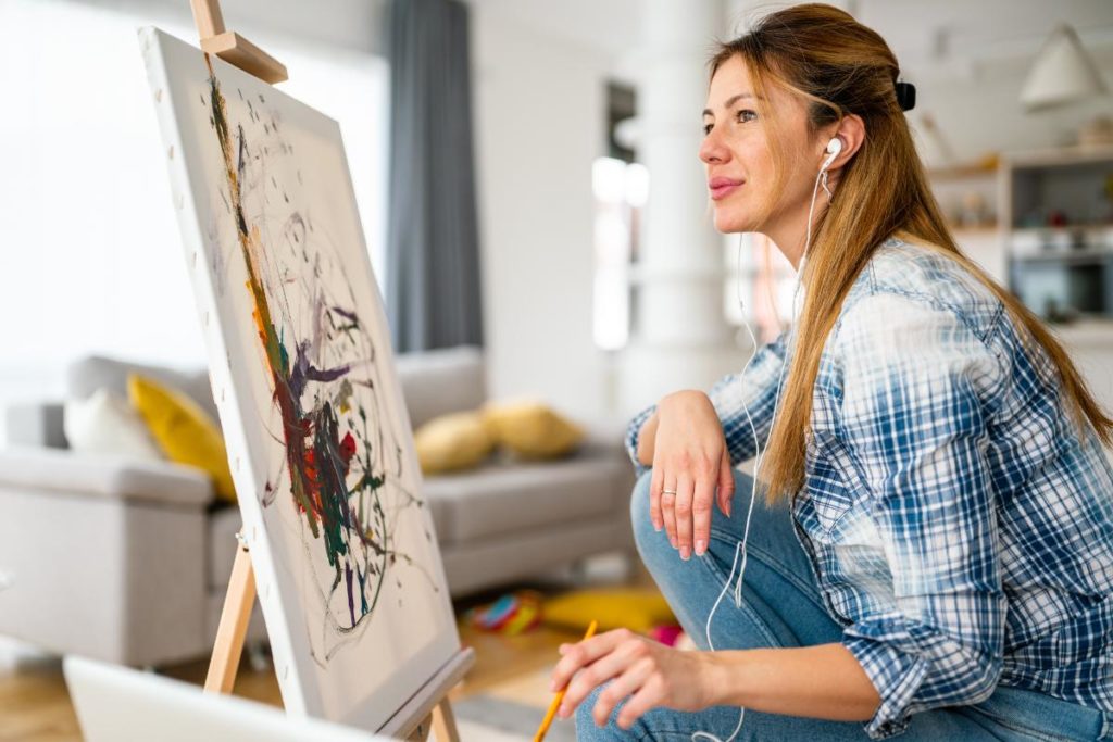 Woman learning about the benefits of art therapy