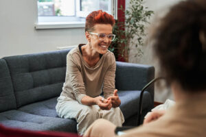 woman with red hair talks with therapist about treatment options for adhd
