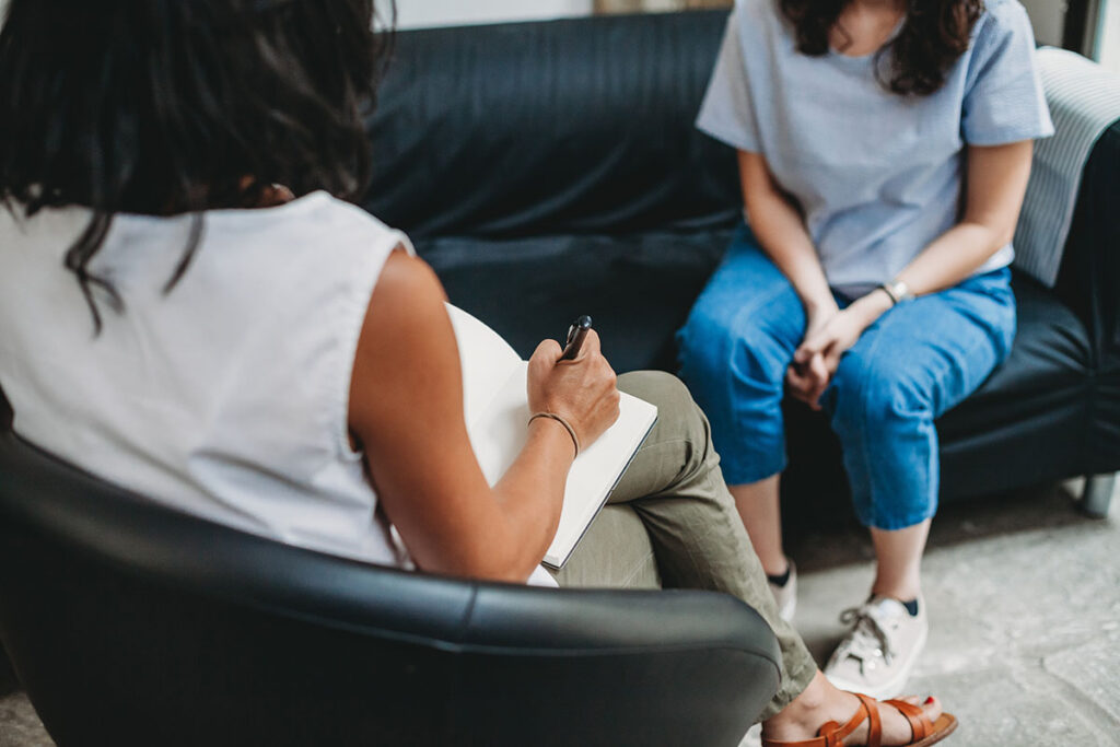 two people talk while sitting during bipolar disorder treatment santa ana