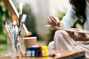 someone paints to show art therapy for trauma